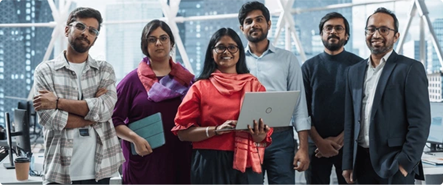 Professional team standing together in modern office